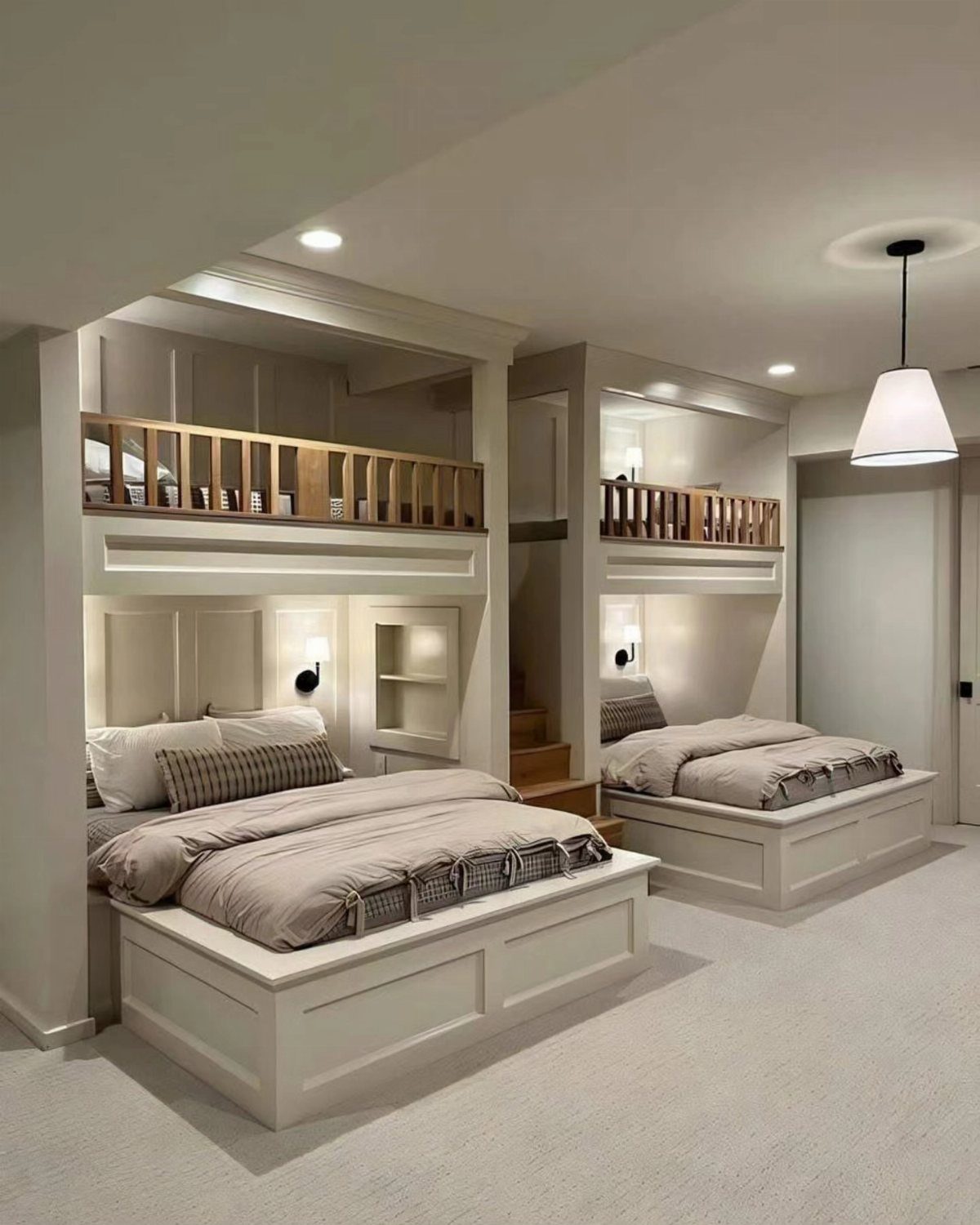 White built-in bunk beds with wooden railings and beige bedding in a bedroom.