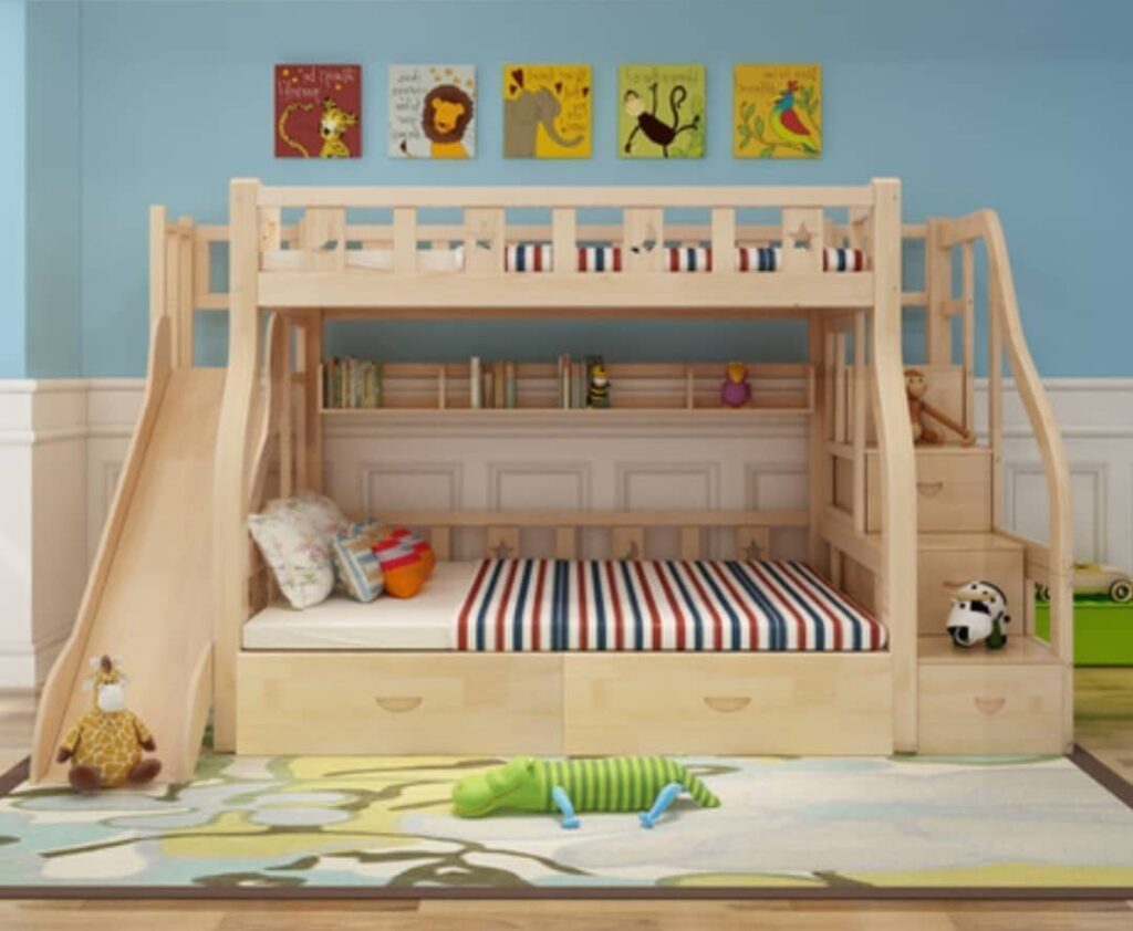 Wooden bunk bed with a slide, stairs, and storage in a child's bedroom.