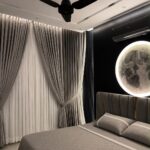 Grey and white layered curtains in a modern bedroom with a moon light.