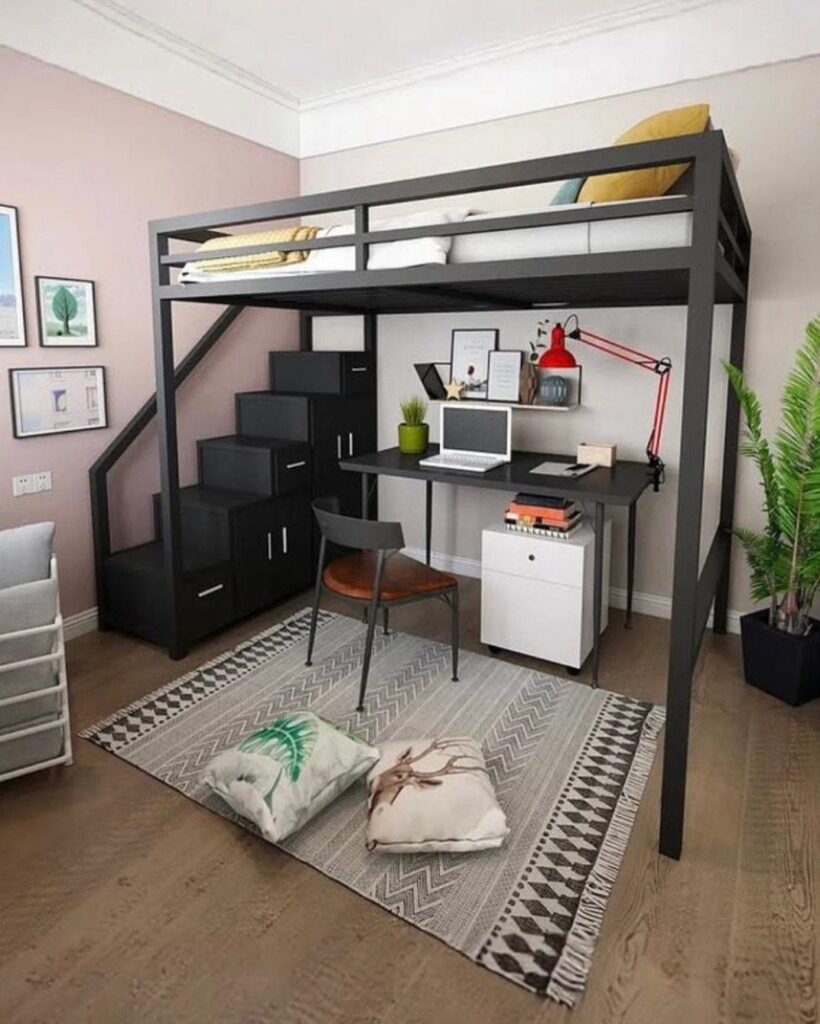 Black metal loft bed with a functional desk workspace and chair underneath.